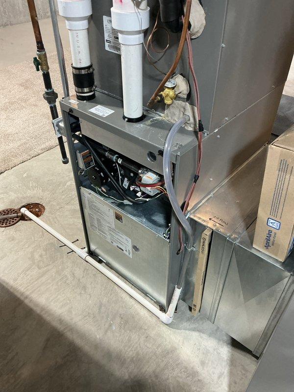 # HVAC Heating System Tune-Up Completed

Performed comprehensive seasonal tune-up on basement furnace unit including inspection of all major components, burner assembly, heat exchanger, and blower motor. Verified proper operation of wall-mounted humidifier system with copper supply line connections and tested electrical connections. All systems operating within manufacturer specifications with no deficiencies noted at time of service.