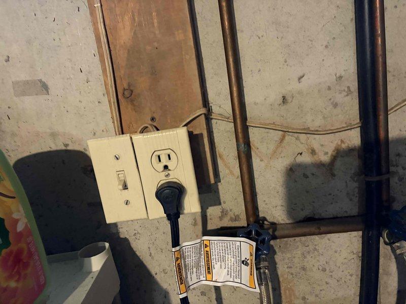 Completed comprehensive annual electrical safety inspection of residential property. Conducted thorough examination of exterior electrical meter assembly, including meter box integrity, warning labels, conduit connections, and digital meter functionality. Inspected interior basement electrical systems, evaluating outlet and switch combinations, wiring condition along exposed studs, and grounding connections near plumbing infrastructure. All components photographed and documented for compliance verification. System found to be operating within normal parameters with no immediate safety concerns identified.