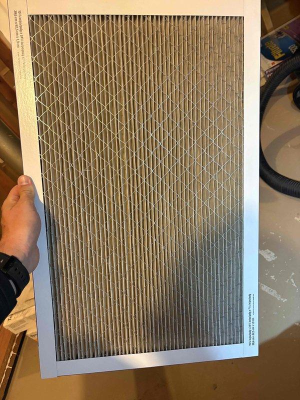 Completed comprehensive heating tune-up on 6-year-old basement furnace unit, including full system inspection, combustion analysis, and filter replacement. Investigated customer concern regarding white residue on furnace pipe and documented findings with photos. System tested and verified operational with thermostat displaying proper heating function at 72°F setpoint.