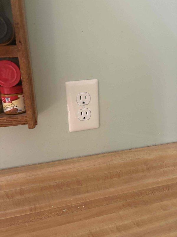 Responded to electrical safety concern in kitchen where homeowner experienced a power surge that damaged an appliance and discovered a loose wire behind the outlet during attempted replacement. Inspected electrical outlet and wiring, identified and secured loose connection in wall box, tested circuit for proper grounding and voltage stability, and replaced damaged outlet with new receptacle to ensure safe operation and prevent future electrical hazards.