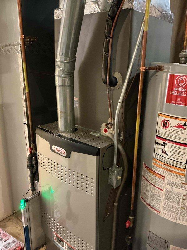 Completed comprehensive super tune maintenance service on two HVAC units, including one outdoor condensing unit located in the side yard and one Lennox furnace system in the basement. Performed thorough electrical diagnostics using digital multimeter to verify proper voltage and amperage readings across control boards and electrical components, inspected all refrigerant lines, ductwork connections, and wiring harnesses for both systems. All equipment tested within manufacturer specifications, with both units under 10 years old showing normal operating parameters and requiring no corrective actions at this time.