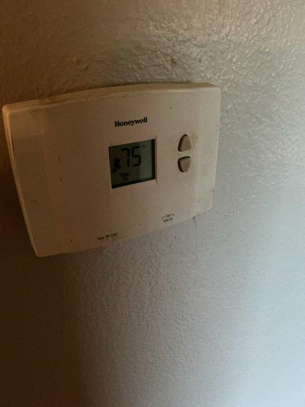 Performed operational verification and tune-up on heating system for vacant residential property in preparation for as-is home sale. Confirmed thermostat functionality with unit responding to heat call, verified proper system operation with supply air temperature measuring 146.6°F at register, and conducted visual inspection of accessible components. System found to be operational with no immediate deficiencies noted during standard tune-up procedures.