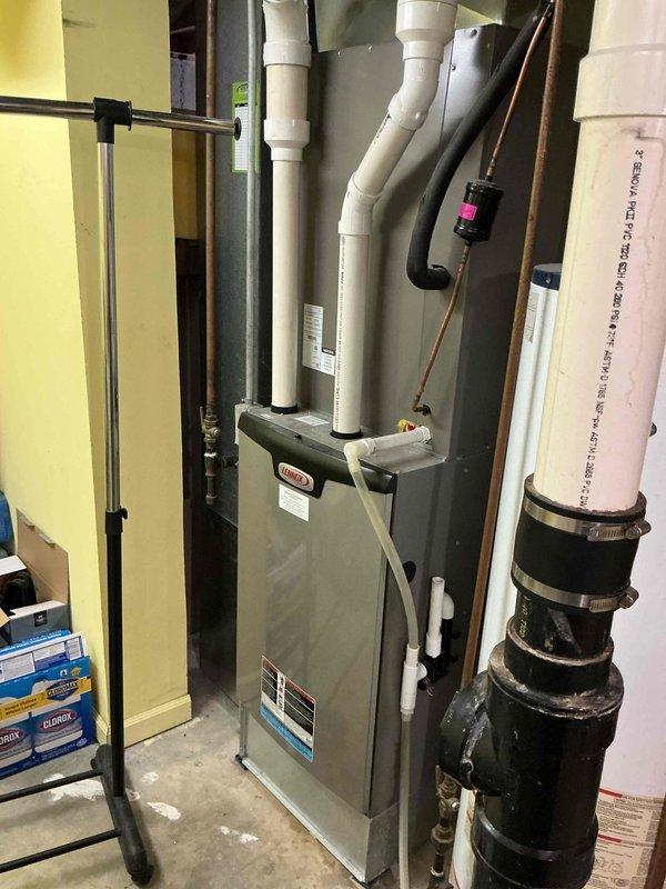 Completed heating tune-up on basement furnace unit. Performed comprehensive system inspection, verified proper operation of all components, and confirmed thermostat functionality with digital display reading 72 degrees. All equipment operating within normal parameters with no issues identified.