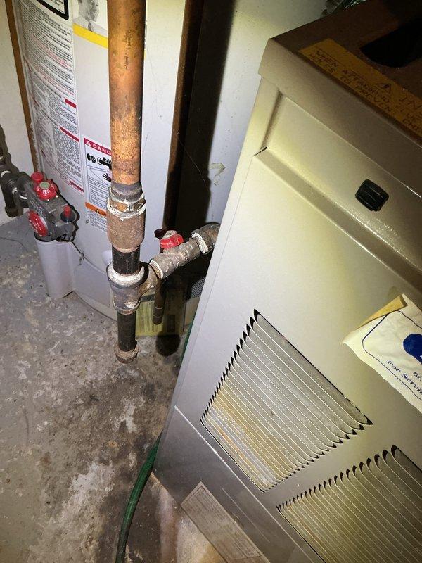 Completed furnace tune-up on a single heating unit located in the basement. Performed standard preventive maintenance inspection including filter check, burner examination, and system operation verification. Documented existing water damage or rust staining visible on wall surfaces near the HVAC installation area, noting the discoloration pattern consistent with moisture intrusion along corner seams. Unit operational at time of departure with no immediate service concerns identified during the tune-up procedure.