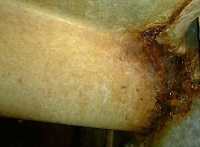 Completed furnace tune-up on a single heating unit located in the basement. Performed standard preventive maintenance inspection including filter check, burner examination, and system operation verification. Documented existing water damage or rust staining visible on wall surfaces near the HVAC installation area, noting the discoloration pattern consistent with moisture intrusion along corner seams. Unit operational at time of departure with no immediate service concerns identified during the tune-up procedure.
