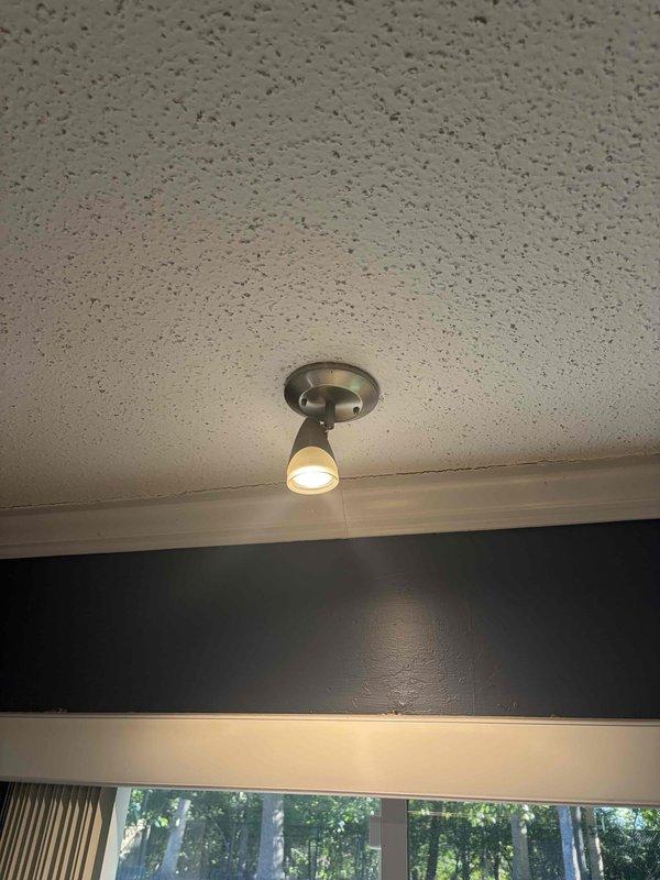 Inspected and tested double light switch and outlet as reported. Verified proper operation of decorative double toggle switch mounted on kitchen backsplash and adjustable spotlight fixture. All electrical components functioning correctly with no replacement necessary.