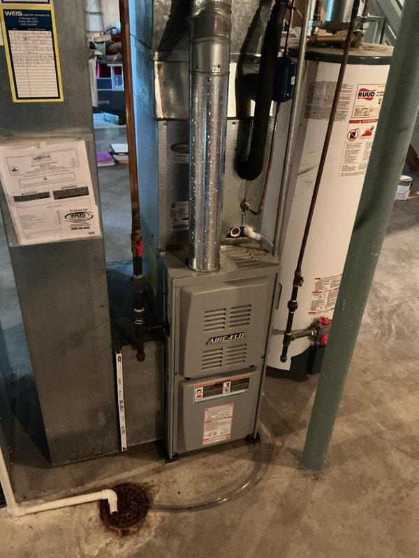 Replaced failed ADP coil (serial number 7117e34270) in residential split system air conditioning unit. Retrieved replacement coil from warehouse, installed new evaporator coil in basement air handler, evacuated and recharged system with R-410A refrigerant to manufacturer specifications, and verified proper operation of heating and cooling functions using digital manifold gauges at outdoor condensing unit. Removed and disposed of defective coil, confirmed system pressures and temperatures within normal parameters, and left unit operational.