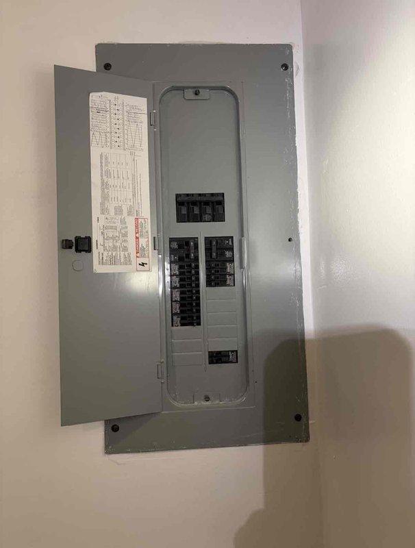 Completed electrical service estimate and sold project for ceiling fan installation, outlet relocation, and circuit removal. Accessed existing junction box with multiple wire connections and evaluated electrical panel with circuit breaker configuration to determine scope of work for upcoming modifications.