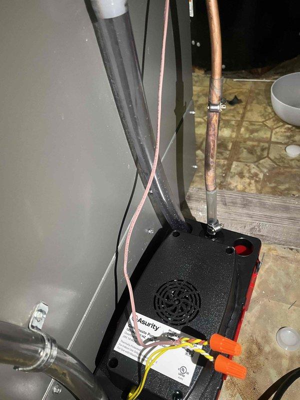 Replaced failed Asurity condensate pump on HVAC air handler system, marking the third pump failure at this location. Investigated potential causes for recurring pump failures including drainage issues, electrical connections, and installation positioning to prevent future replacements. Verified proper wiring connections, tested pump operation, and retained failed unit for further analysis.