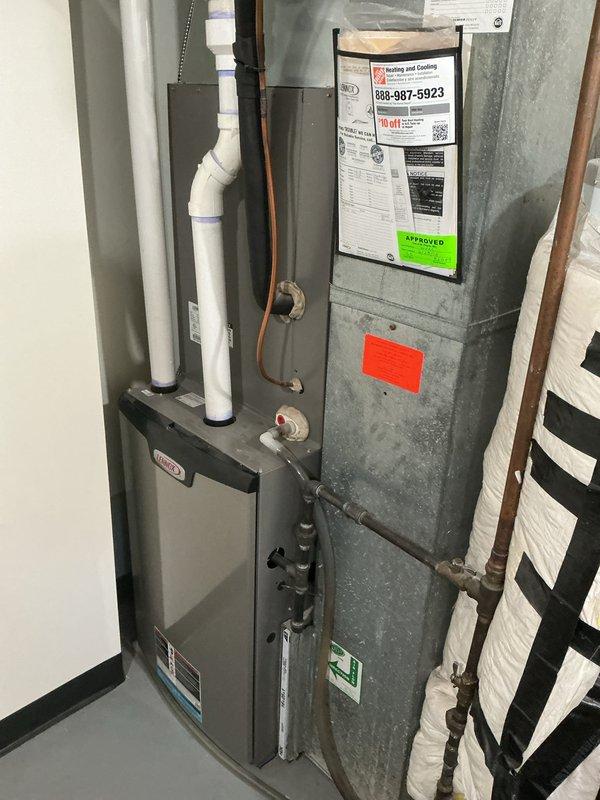 Completed comprehensive tune-up on U10 furnace system located in basement during scheduled 8-12pm time frame. Performed standard maintenance procedures including inspection of furnace cabinet, air handler, refrigerant lines, and PVC condensate drainage system. Verified thermostat operation showing proper temperature reading of 70°F and confirmed all system components, connections, and safety labels were intact and functioning properly.