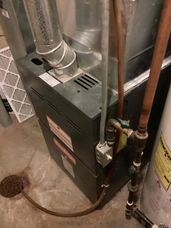 Completed heating tune-up and safety inspection on 14-year-old residential furnace unit located in basement. Performed comprehensive system evaluation including burner inspection, heat exchanger examination, gas pressure verification, blower motor operation check, and filter assessment. Verified thermostat functionality showing proper temperature control at 72 degrees, tested all safety controls, and confirmed proper venting and ductwork connections. System operating within manufacturer specifications with no immediate concerns identified.