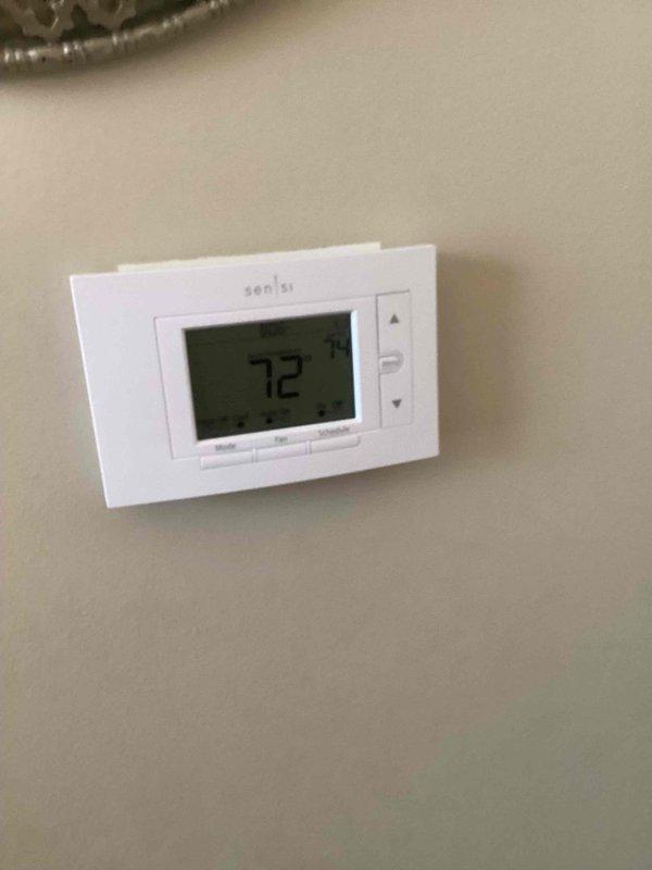 Completed heating tune-up and safety inspection on 14-year-old residential furnace unit located in basement. Performed comprehensive system evaluation including burner inspection, heat exchanger examination, gas pressure verification, blower motor operation check, and filter assessment. Verified thermostat functionality showing proper temperature control at 72 degrees, tested all safety controls, and confirmed proper venting and ductwork connections. System operating within manufacturer specifications with no immediate concerns identified.