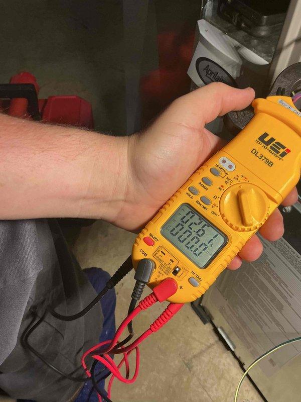 Completed comprehensive heating tune-up on basement furnace unit. Performed diagnostic testing using digital multimeter to verify electrical components and system performance, inspected internal components with panel open to assess condition of circuit boards and wiring connections, and conducted standard maintenance procedures to ensure optimal system operation for the heating season.