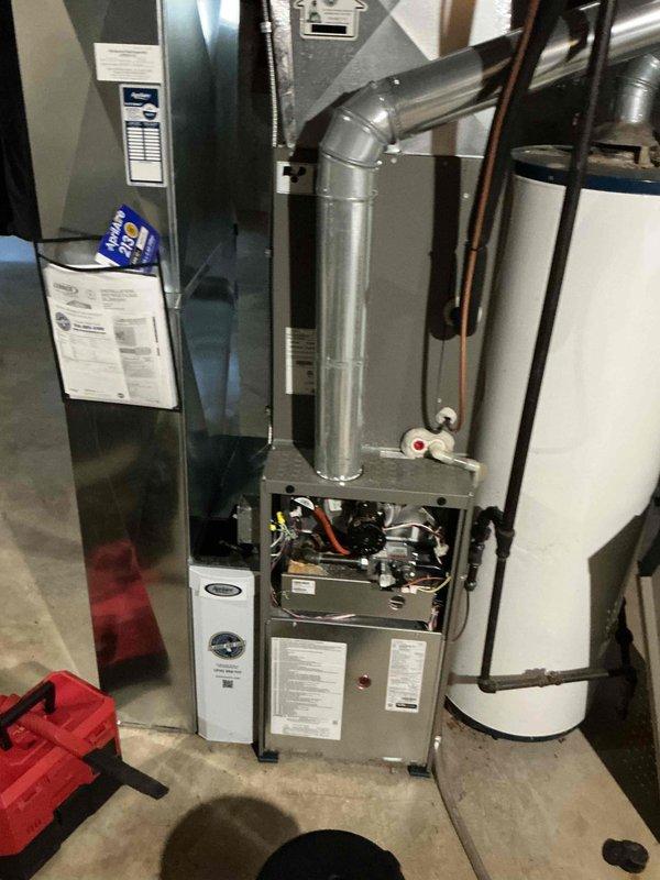 Completed comprehensive heating tune-up on basement furnace unit. Performed diagnostic testing using digital multimeter to verify electrical components and system performance, inspected internal components with panel open to assess condition of circuit boards and wiring connections, and conducted standard maintenance procedures to ensure optimal system operation for the heating season.