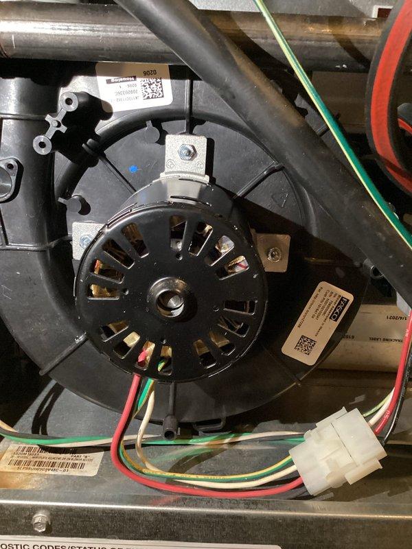 Responded to error message regarding pressure switch calibration failure on basement furnace unit. Upon inspection, diagnosed faulty blower motor assembly causing improper airflow and preventing pressure switch from calibrating correctly. Replaced FASCO blower motor, reconnected electrical wiring harness, and verified proper operation of all motor terminals and connections. System tested successfully with pressure switch now calibrating within manufacturer specifications.