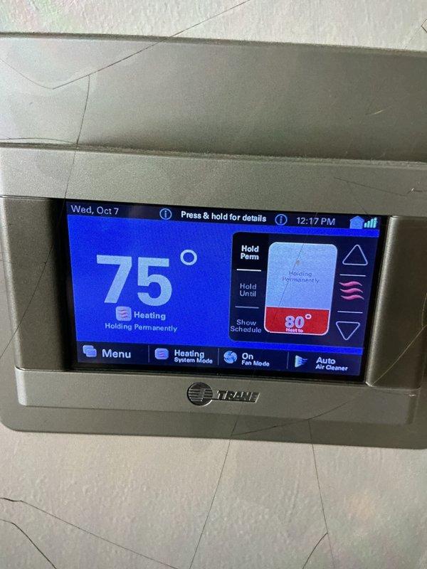 Completed comprehensive Supertune maintenance service on two HVAC systems located in basement and ground level areas. Performed full system inspection, cleaned and tested both furnaces and air conditioning units, checked refrigerant levels, inspected electrical connections, calibrated thermostats including Trane programmable unit, replaced filters, and verified proper operation of all components. Customer-maintained humidifier was inspected and serviced as part of the preventive maintenance agreement.