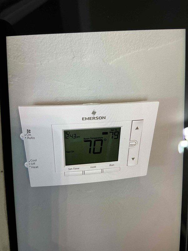 Completed comprehensive furnace tune-up on U10 unit located in basement. Performed standard maintenance inspection, verified thermostat operation (Emerson programmable model displaying proper temperature readings), and confirmed 20x25x1 air filter was clean with adequate airflow. All system components operating within normal parameters.
