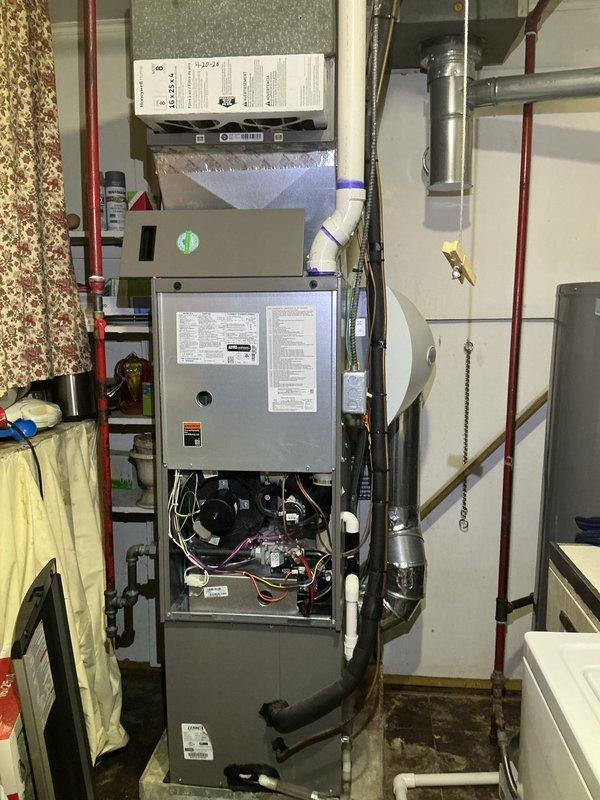 Completed heating tune-up on a 2-year-old furnace located in the utility closet. Performed comprehensive system inspection including blower motor examination, electrical connections check, burner assembly evaluation, and heat exchanger inspection with lower access panel removed for thorough component access. Verified thermostat operation, tested all safety controls, and confirmed proper airflow through ductwork system.