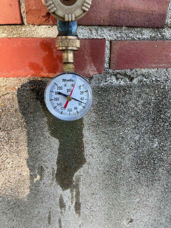 Responded to reported sewer line backup in basement during morning service call. Conducted thorough inspection of basement plumbing system, including existing Kenmore water heater and associated drainage connections. Performed diagnostic assessment of sewer line to identify source of backup issue. Documented current plumbing configuration with copper supply lines and PVC drainage components. Tested water pressure at exterior hose bib using calibrated gauge to evaluate overall system performance and rule out pressure-related factors contributing to drainage problems. Additionally provided estimate for tankless water heater installation as requested by property owner.