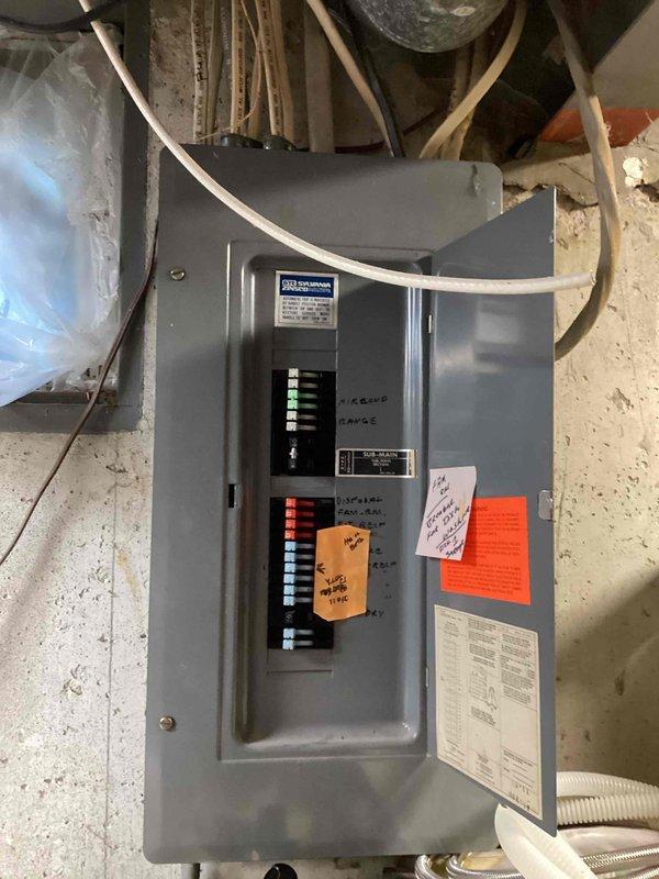 Provided estimate for removal and replacement of existing bathroom exhaust fan. Inspected electrical panel to verify circuit availability and breaker capacity for fan installation. Documented current electrical panel configuration showing Siemens main service panel with multiple circuit breakers and existing labeling system. Assessed wiring routing options through accessible basement/utility area for new fan circuit connection.