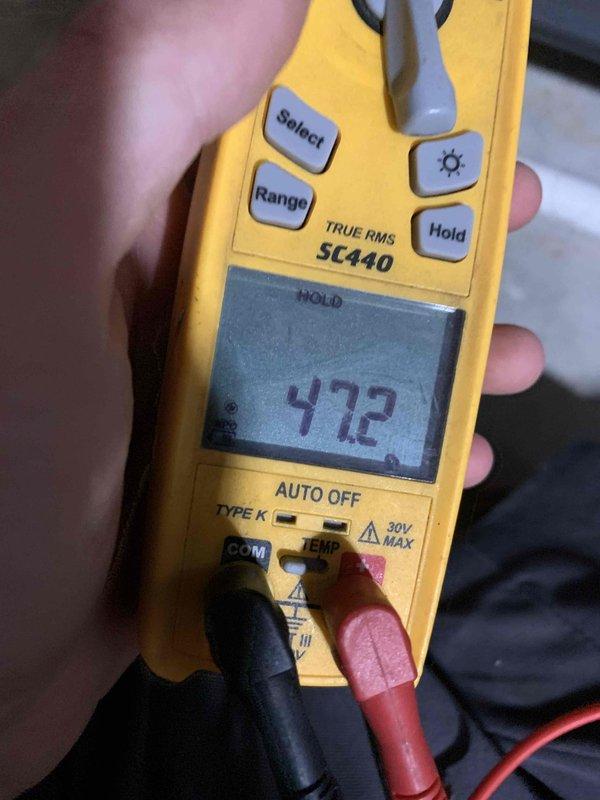 Completed furnace tune-up on 10-year-old unit located in basement. Performed comprehensive maintenance including temperature differential measurements using digital multimeter, which confirmed proper heating operation at 472°F. Verified thermostat functionality with system actively calling for heat and maintaining setpoint of 71°F in heating mode.
