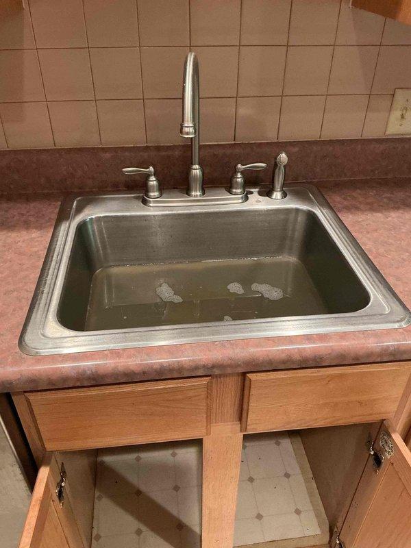 Responded to a clogged kitchen sink requiring roof access. Deployed two-person crew with ladder to clear the obstruction from the rooftop vent stack as specified. Successfully cleared the blockage, restoring proper drainage to the kitchen sink and plumbing system.