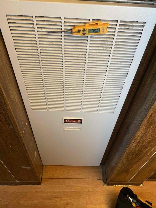 Completed heating tune-up on Coleman furnace unit located in utility closet. Performed comprehensive system inspection, took diagnostic readings showing 780 CFM airflow, verified proper operation of all components, and documented equipment condition with photos of thermostat and main unit.