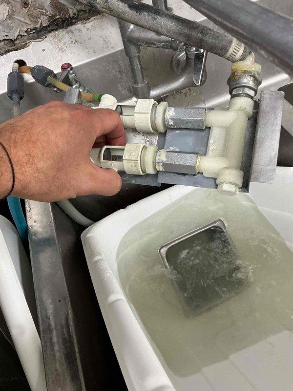 Responded to backed up drain in kitchen at commercial property. Upon inspection, identified clogged main drain line affecting kitchen drainage system. Performed drain cleanout service using appropriate tools and methods to clear blockage and restore proper flow. Inspected HVAC condensate drain system and associated plumbing connections, noting moisture accumulation on ductwork and verifying condensate pan drainage. Tested system operation to confirm all drains flowing freely with no backup issues remaining.