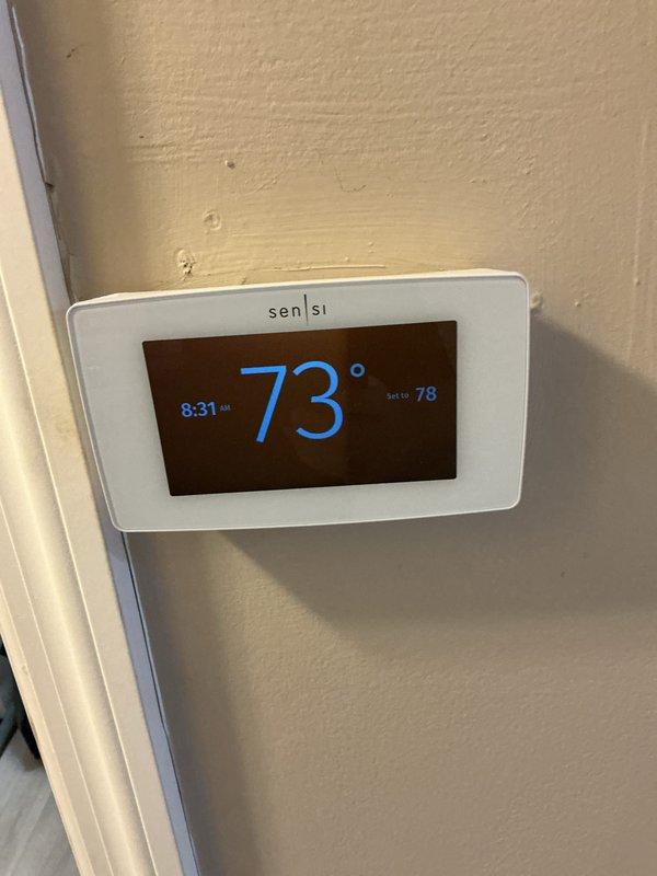 Completed preventive maintenance tune-up on Carrier furnace/air handler unit located in utility closet. Performed comprehensive system inspection, verified thermostat operation (Sensi model displaying proper temperature readings), and ensured all mechanical components were functioning within manufacturer specifications for optimal heating system performance.
