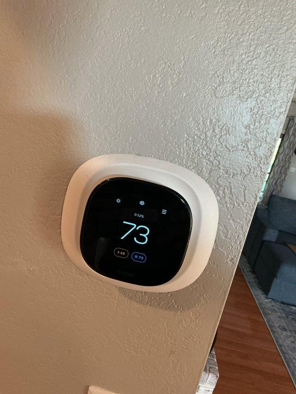 Completed comprehensive tune-up service on two 10-year-old furnace units located in basement. Performed full system inspection including electrical connections, terminal integrity, capacitor testing, and blower assembly evaluation on both units. Verified thermostat operation and temperature calibration, confirming proper communication between control system and heating equipment.