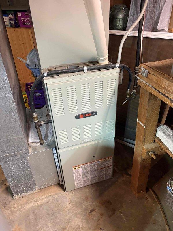 Completed comprehensive heating maintenance tune-up on 15-year-old Trane XR furnace unit that had not received preventive maintenance for several years. System was operating properly upon arrival, and customer requested proactive service before the heating season. Performed full inspection of all furnace components, verified proper operation of gas connections and venting systems, inspected and documented condition of pleated air filter within ductwork, and ensured unit is ready for reliable winter operation.