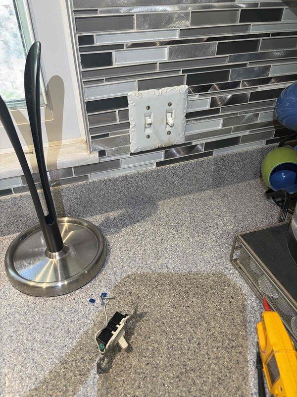 Responded to service callback for intermittent garbage disposal switch operation. Upon inspection, identified faulty dual switch assembly on kitchen backsplash that was causing the disposal to shut off randomly during operation. Removed and replaced defective switch with new unit, verified proper wiring connections, and tested both switches for correct functionality. Disposal now operates consistently without interruption.
