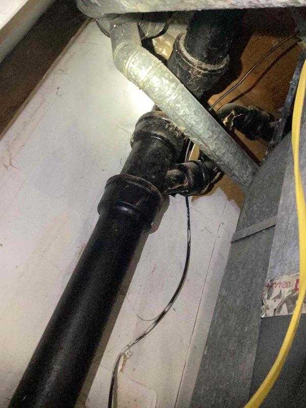 Completed heating tune-up on furnace unit located in basement utility area near water heater. Performed standard maintenance inspection of heating system components and gas connections. Inspected and replaced heavily soiled 16x25x1 air filter that showed significant dust accumulation, which was restricting proper airflow to the system. System operational upon completion of service.
