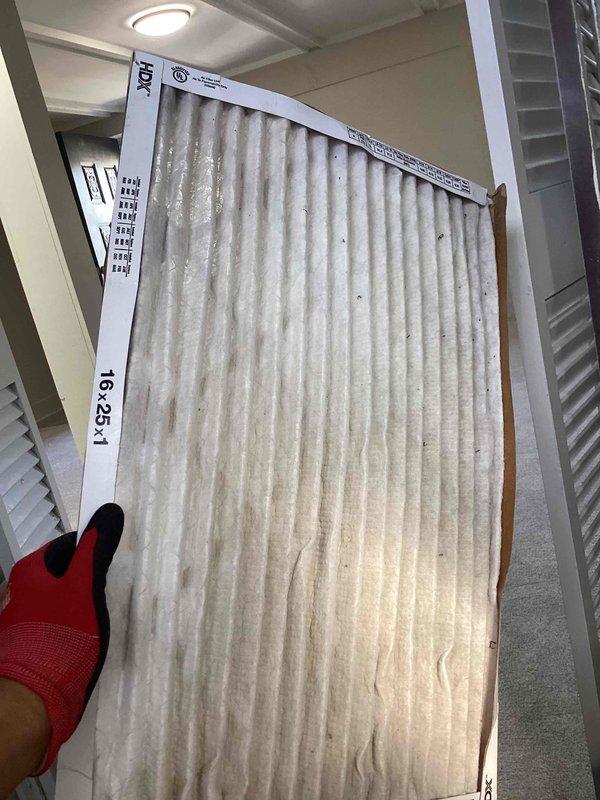 Completed heating tune-up on furnace unit located in basement utility area near water heater. Performed standard maintenance inspection of heating system components and gas connections. Inspected and replaced heavily soiled 16x25x1 air filter that showed significant dust accumulation, which was restricting proper airflow to the system. System operational upon completion of service.