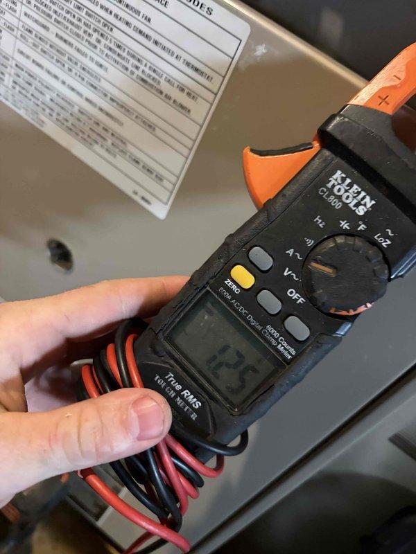 Completed comprehensive tune-up service on a 30-year-old furnace located in basement. Performed full system inspection with access panel removed, examining gas valve assembly, burner array, heat exchanger, and all internal components. Verified proper electrical connections and measured operating amperage at 12.2 amps using clamp meter, confirming system is drawing within normal parameters. Inspected blower motor assembly, gas piping, wiring harnesses, and safety controls for proper operation and wear. All components found to be functioning adequately for the unit's age, with typical dust accumulation and minor surface wear consistent with three decades of operation. System operational and safe for continued use.