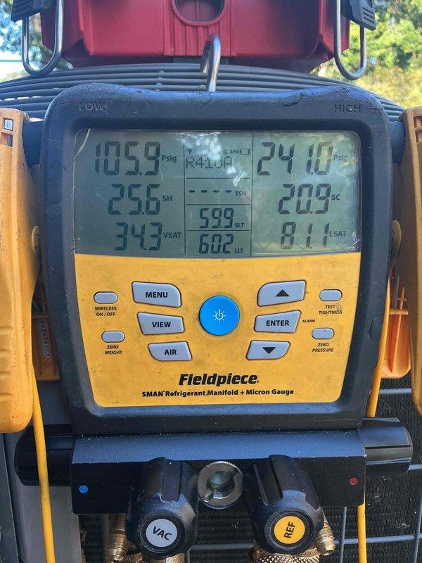 Responded to no cool call on 10+ year old system with no airflow. Upon arrival, performed comprehensive diagnostic evaluation using digital manifold gauges to assess refrigerant pressures and system performance. Measured operating pressures at 105.9 psi high side and 24.10 psi low side with superheat and subcooling readings to determine system efficiency. 

Inspected electrical components in outdoor unit, including capacitor (TRCFD355, 440/370 VAC rated) and contactor assembly. Verified all wire connections and terminals for proper operation. Conducted complete tune-up and maintenance service to restore system functionality and address airflow concerns. System tested and operational upon completion.