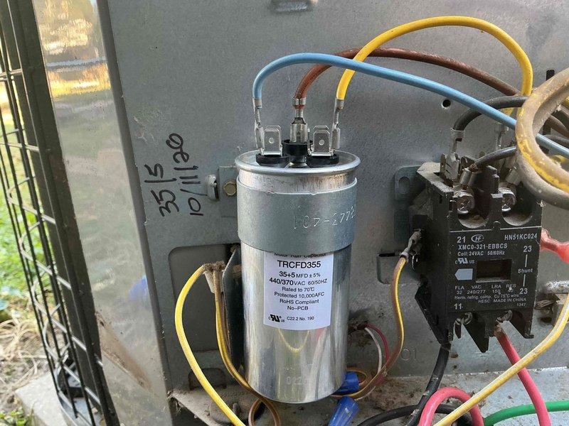 Responded to no cool call on 10+ year old system with no airflow. Upon arrival, performed comprehensive diagnostic evaluation using digital manifold gauges to assess refrigerant pressures and system performance. Measured operating pressures at 105.9 psi high side and 24.10 psi low side with superheat and subcooling readings to determine system efficiency. 

Inspected electrical components in outdoor unit, including capacitor (TRCFD355, 440/370 VAC rated) and contactor assembly. Verified all wire connections and terminals for proper operation. Conducted complete tune-up and maintenance service to restore system functionality and address airflow concerns. System tested and operational upon completion.