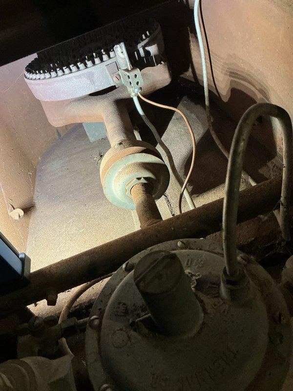 Completed O10 heating tune-up on basement furnace unit. Performed comprehensive inspection of aging system showing significant wear and surface corrosion on cabinet housing. Checked blower motor assembly, drive belt tension and condition, electrical connections, and ductwork. All components operational and system running within acceptable parameters despite age-related deterioration of exterior surfaces.