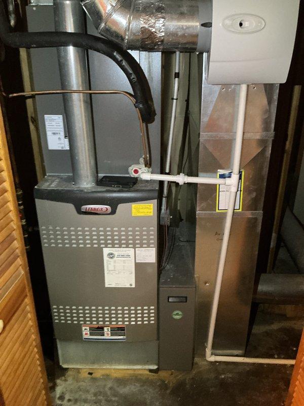 Completed comprehensive winter heating tune-up on 13-year-old Lennox furnace system with no reported operational issues. Performed full preventive maintenance inspection including burner assembly cleaning, heat exchanger examination, blower motor lubrication, air filter replacement, gas pressure verification, flame sensor cleaning, and thermostat calibration check. System operating efficiently with thermostat displaying proper temperature readings and all safety controls functioning within manufacturer specifications.