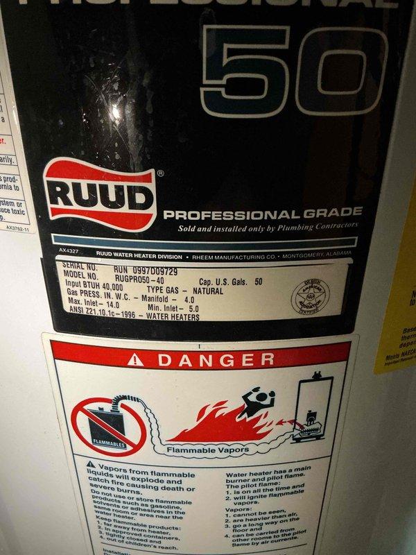 Installed a new 50-gallon Ruud Professional Grade gas water heater (Model RUGPRO50D-ePb) in accordance with permit #26PLU-20082. Applied required plumbing identification sticker to the unit and ensured all manufacturer safety labels were properly visible and intact. Installation completed to code specifications with all gas connections, venting, and water supply lines properly configured for safe operation.
