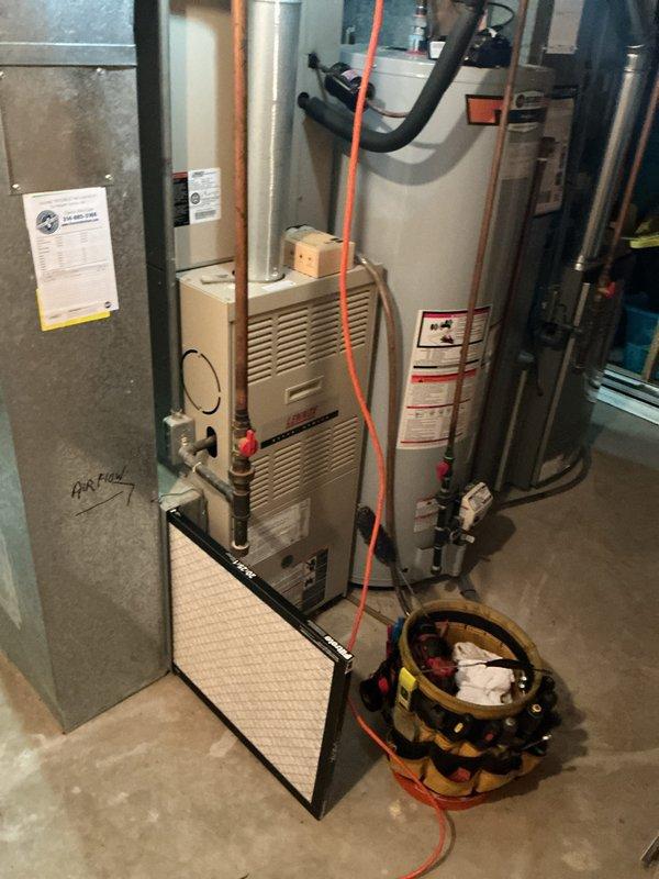 Completed heating tune-up maintenance on residential forced air furnace located in basement mechanical room. Performed comprehensive system inspection including burner assembly, heat exchanger, blower motor, and electrical connections. Replaced air filter and verified proper operation of all safety controls and venting components.