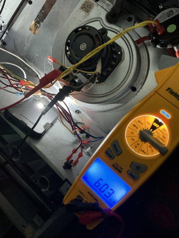 Completed comprehensive heating tune-up on basement furnace unit. Performed diagnostic testing including electrical measurements showing 603 reading on multimeter, inspected blower assembly and motor components, checked all wire connections and safety controls, and examined 16x25 filter/ductwork area. All systems operating within normal parameters upon completion.