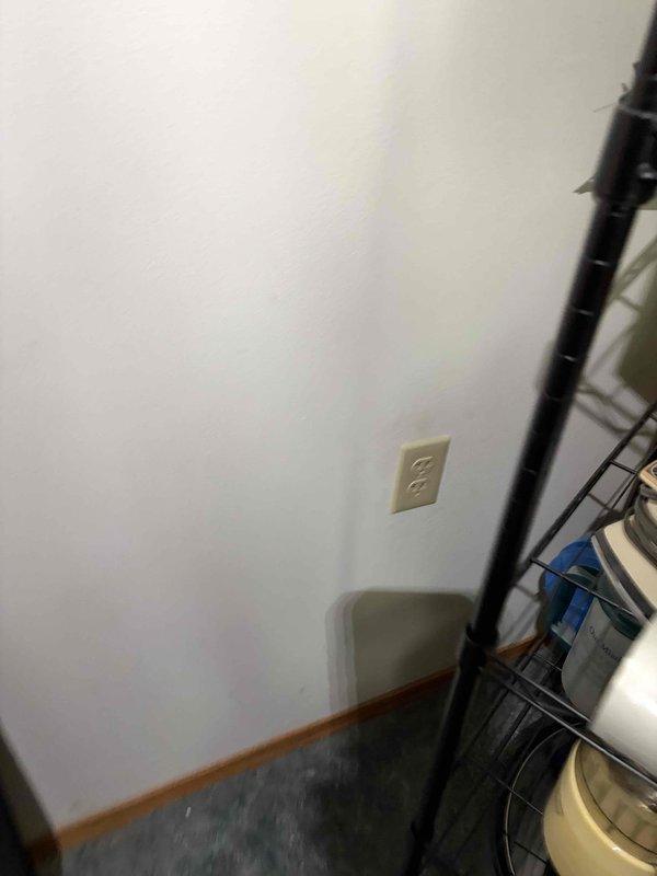Completed electrical rewire installation including installation of new duplex receptacle outlets in multiple locations throughout the property. Installed code-compliant beige duplex receptacles on ceiling and wall surfaces with proper grounding and secure mounting to existing electrical boxes.