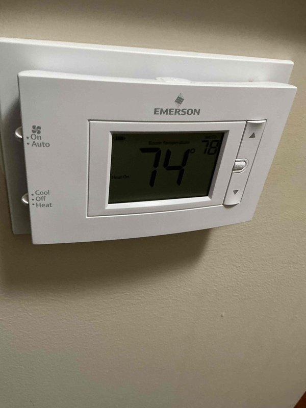 Performed a heating tune-up on a 3-year-old gas furnace, removing the front access panel to inspect the inducer motor, pressure switch and tubing, gas valve and piping, burner compartment, and wiring connections. Verified thermostat operation by confirming a call for heat with the system set to Heat and the display reading 74° against a 78° setpoint, and the furnace is operating normally.