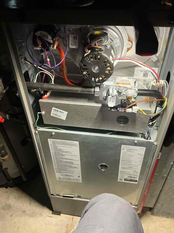 Performed a heating tune-up on a 3-year-old gas furnace, removing the front access panel to inspect the inducer motor, pressure switch and tubing, gas valve and piping, burner compartment, and wiring connections. Verified thermostat operation by confirming a call for heat with the system set to Heat and the display reading 74° against a 78° setpoint, and the furnace is operating normally.