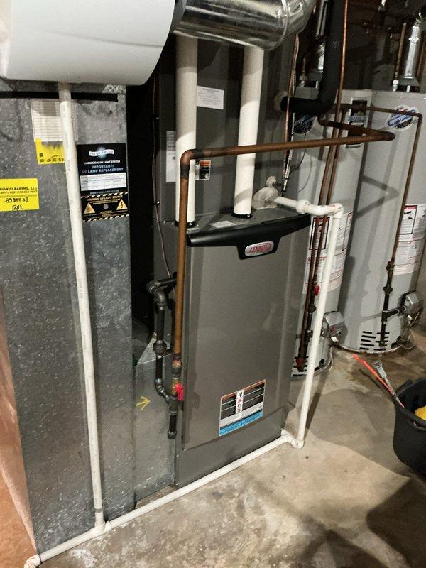 Performed a heating tune-up on one Lennox gas furnace (approximately 2 years old). Inspected the burner assembly and flame sensor, removed and serviced the sensor to ensure proper flame rectification, and checked the PVC intake/exhaust venting, gas piping and shutoff valve, and surrounding ductwork for leaks or damage. No rust, frost, or other visible deficiencies were found, and the unit was returned to normal operation.