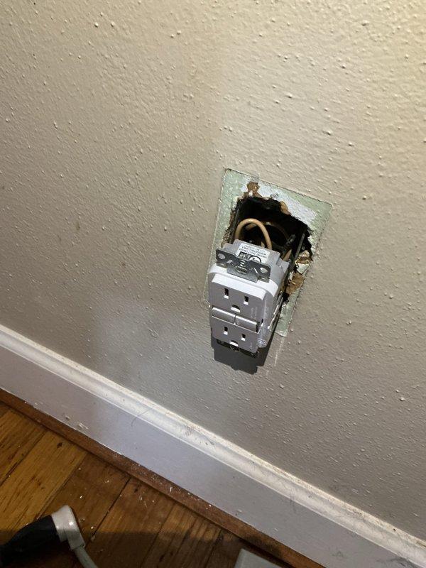 Responded to a partial circuit power loss, inspected the main service panel and branch circuit breakers, and traced the affected circuit to a GFCI receptacle that was loose and not seated flush in a damaged wall opening. Inspected the receptacle wiring and connections for faults or loose terminations, and restored power to the affected circuit. Note that the drywall around the device is torn, and the receptacle remains without a cover plate and requires proper securing and wall repair.