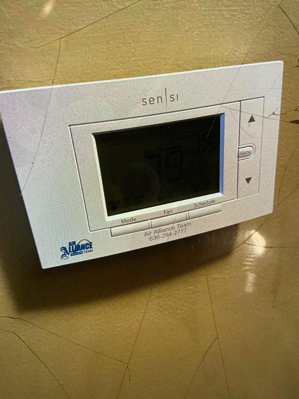 Performed a heating tune-up on a gas furnace, removing the front access panel to inspect the control board, relays, wiring harness, venting, and PVC condensate/vent piping for proper connections and condition. Verified thermostat operation and system response, and checked the filter condition and the adjacent humidifier installation. Reinstalled the access panel and confirmed the system was left in working order.