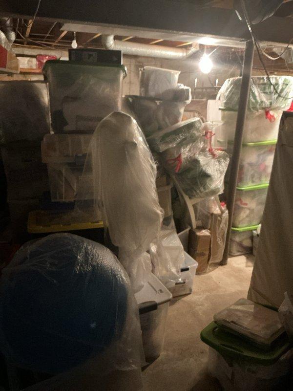 Responded to a main line backup and performed a main drain cleanout, using a drain machine with the appropriate cutting head to clear the blockage and restore full flow through the sewer line. Verified proper drainage by running water through the system and confirmed no remaining backup or standing water at fixtures. The work area was dense with stored items, so access was limited, and the area was left clean and in the same condition on completion.