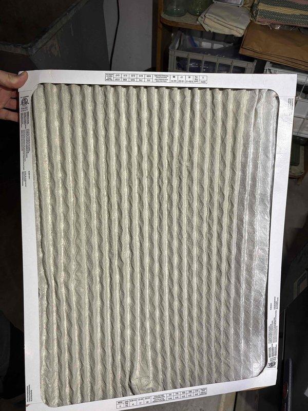 Performed a heating tune-up on the furnace, inspecting the plenum, ductwork, and bypass humidifier connection, and found no visible rust, frost, or damage to the equipment. Inspected the air filter and found it heavily loaded with dust and debris, indicating it is due for replacement to maintain proper airflow and system efficiency.
